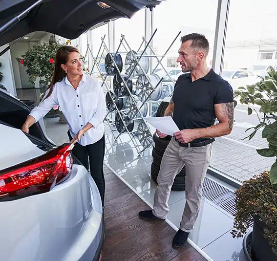 Customer looking at the car from all sides before the purchase