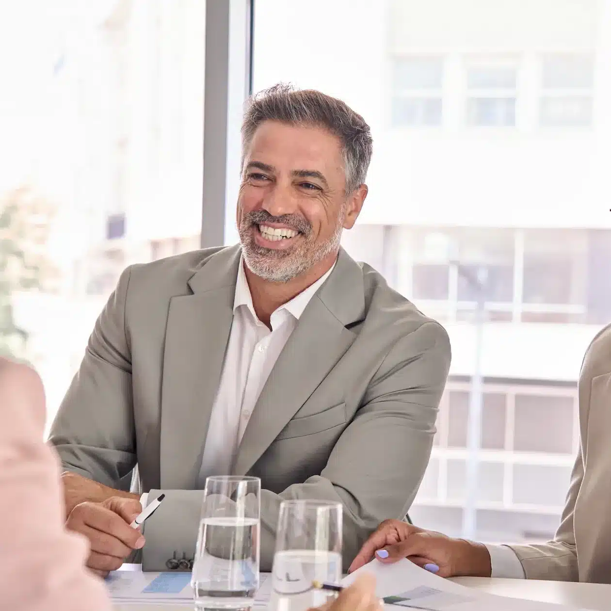Sole trader sitting at a table getting his low rate ABN loan after using Jade Finance business finance repayment calculator.