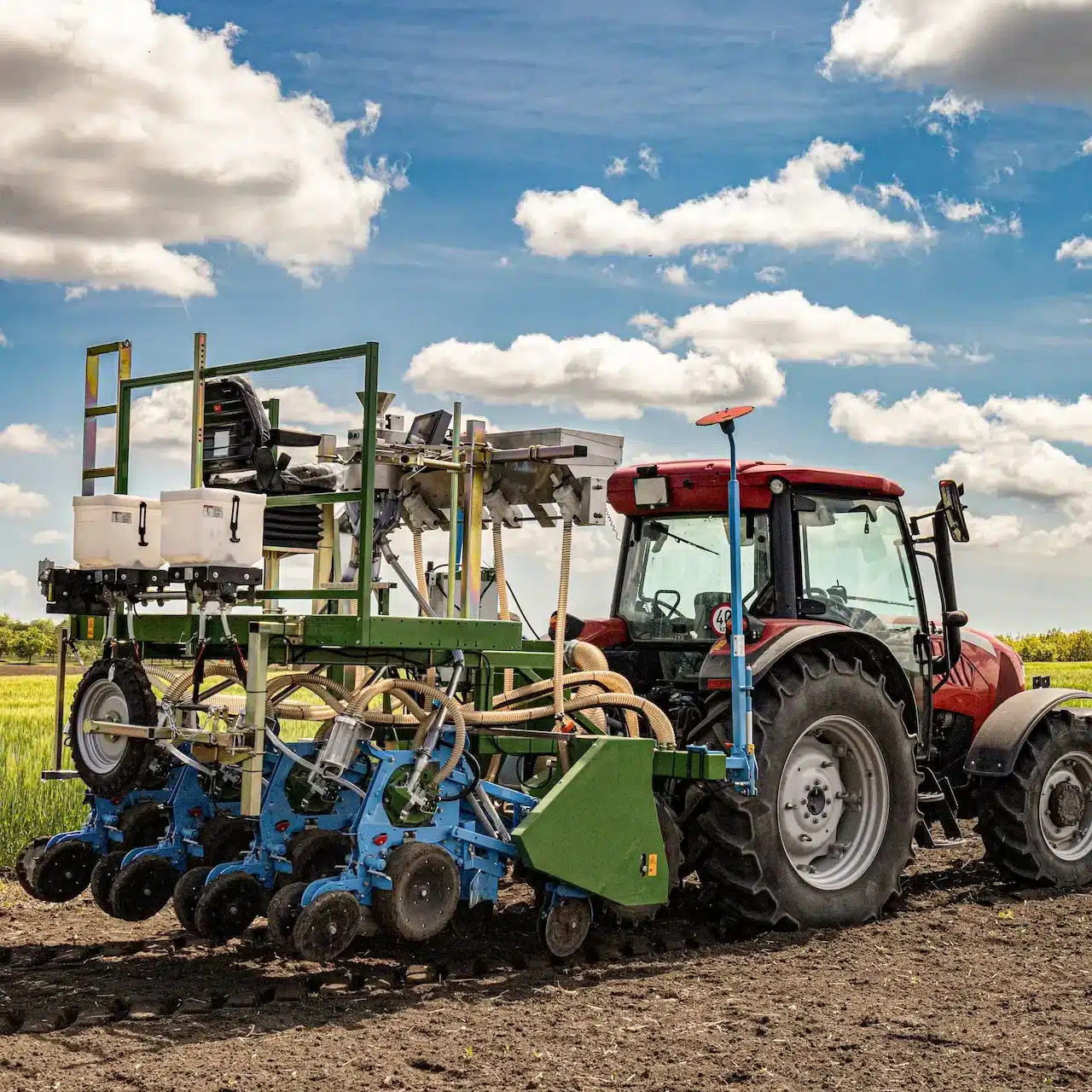 A tractor is seeding a new crop in the field