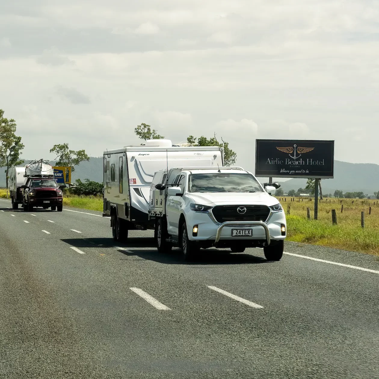 4WDs towing caravans on the open road as the tour Australia