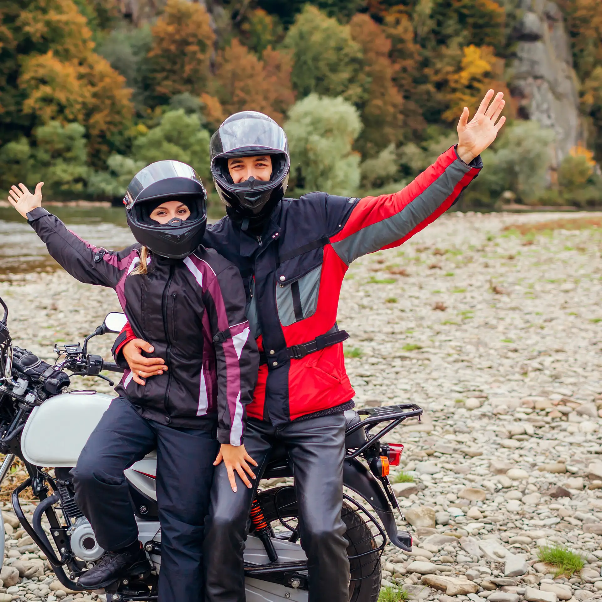 Happy couple on their motorcycle after quickly calculating the affordability of their cheap new bike loan repayments with Jade Finance.
