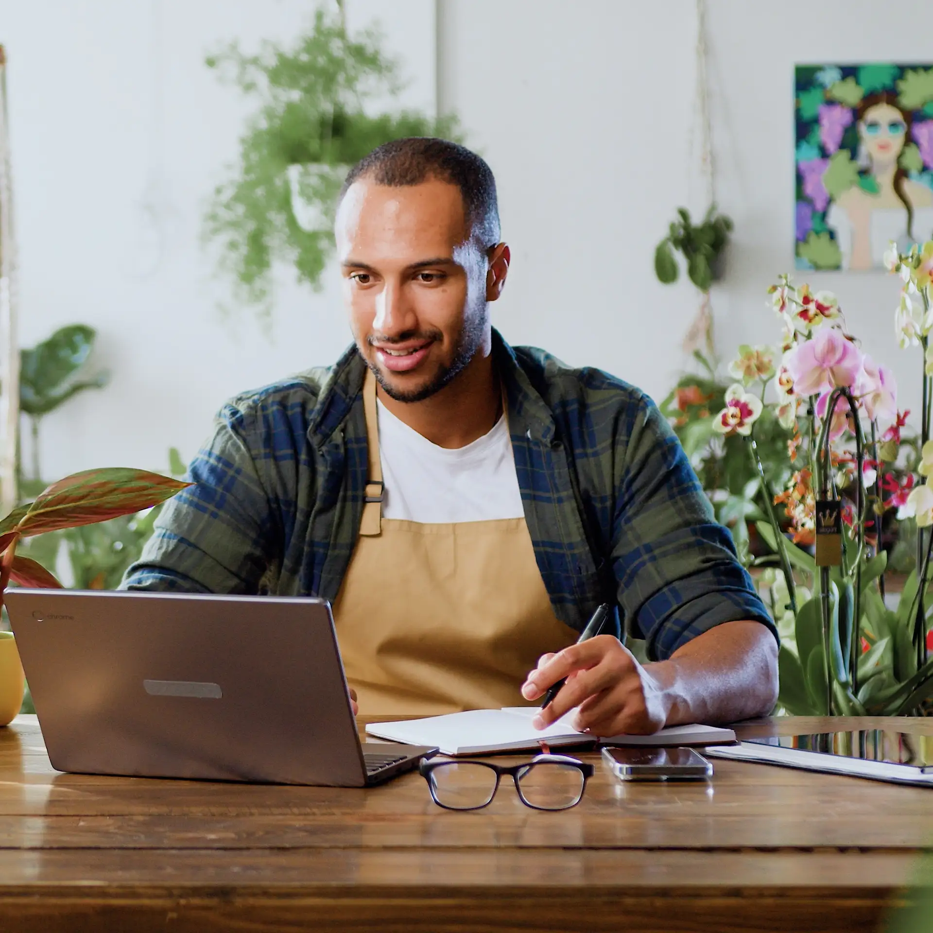 Caucasian florist using a laptop