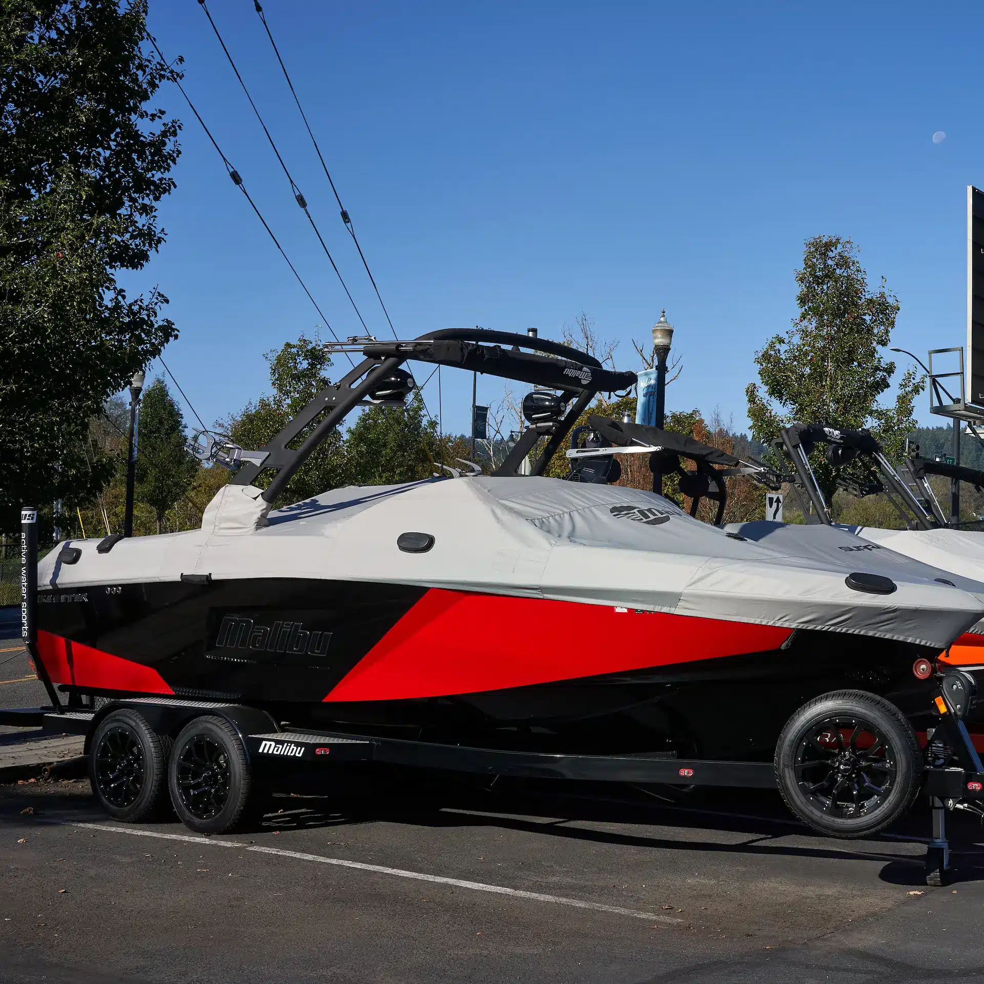 New speed boat on a trailer in a boat dealership year ready for purchase.