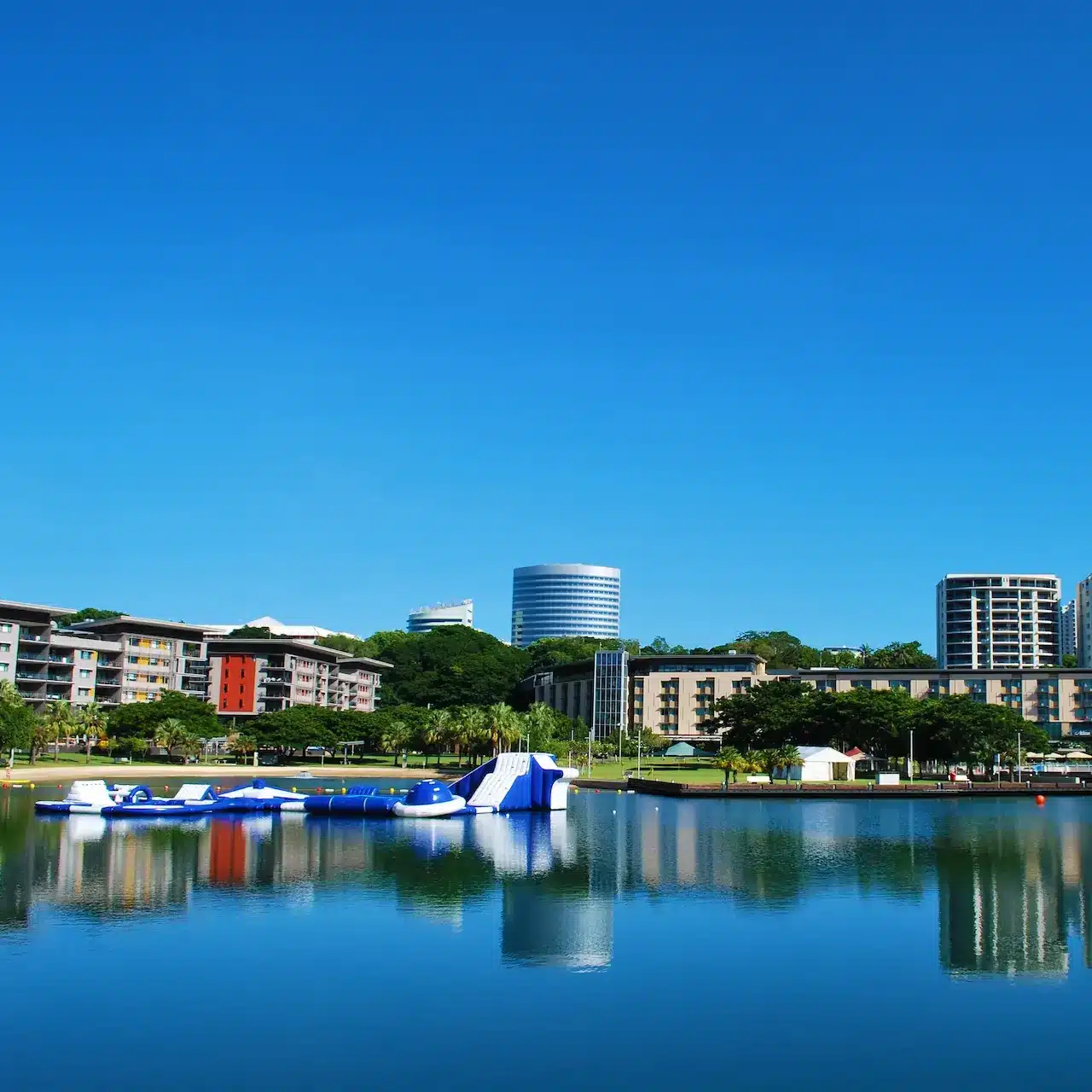 View of part of the Darwin city over the water on a sunny day.