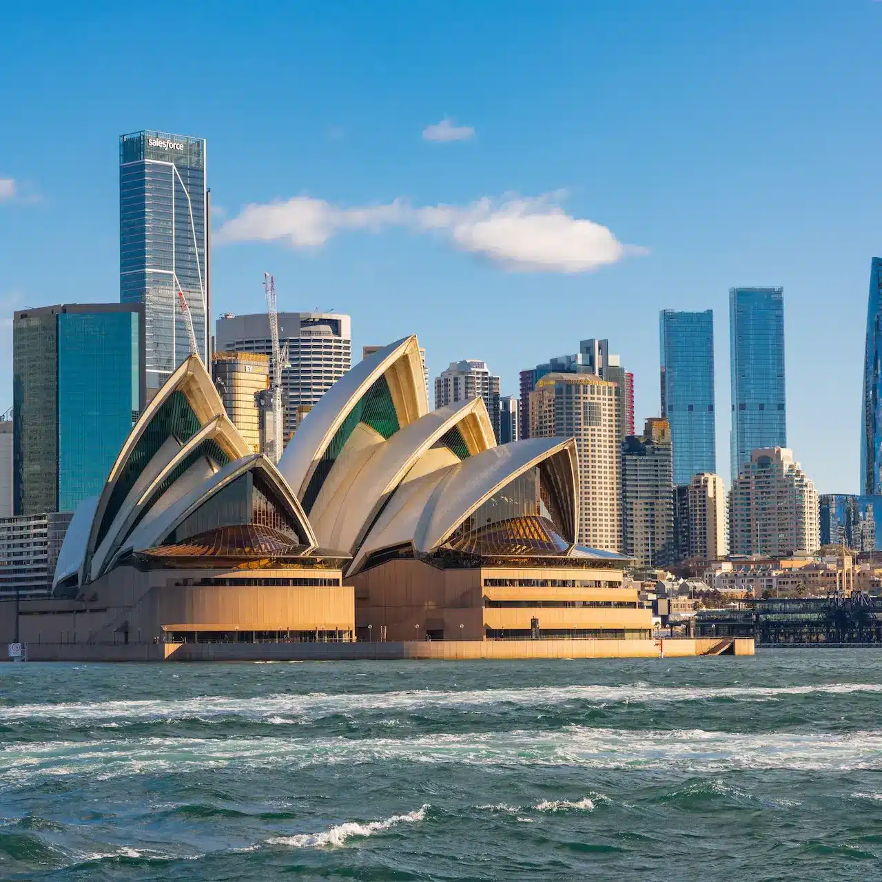 A view of the iconic Sydney landscape featuring the Sydney Opera House from the bay